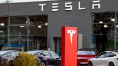 A Tesla Inc. electric vehicle dealership in Berlin, Germany, on Tuesday, Nov. 7, 2023. Tesla will produce a new model that will cost €25,000 ($26,863) at its factory near Berlin, Reuters reported, as competition intensifies to produce more affordable electric vehicles for the European market. Photographer: Liesa Johannssen-Koppitz/Bloomberg