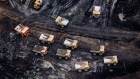 <p>Heavy haulers work in the Athabasca oil sands near Fort McMurray, Alberta.</p>