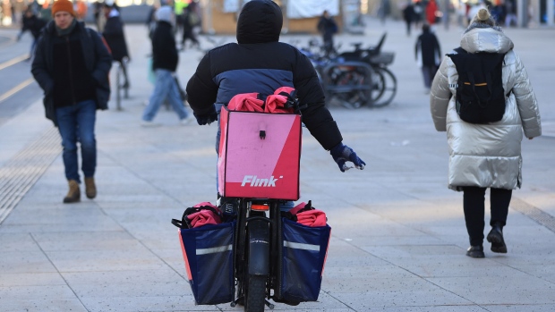 A Flink SE cycle delivery courier during freezing temperatures in Berlin, Germany, on Monday, Jan. 8, 2024. The Arctic blast that caused havoc across the Nordic region last week has spread south to cover most of continental Europe.