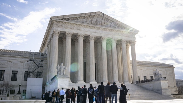 <p>People wait in line to listen to oral arguments at the US Supreme Court in Washington, DC. </p>