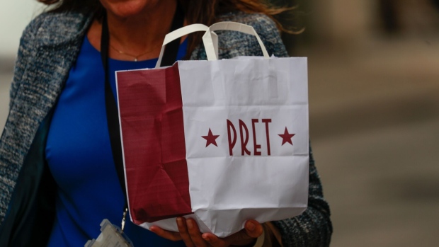 A customer carries a Pret A Manager Ltd. carrier bag in London. Photographer: Jason Alden/Bloomberg