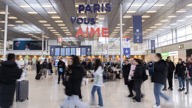 <p>Passengers in the departures hall at Paris-Orly Airport in Paris.</p>