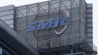 A logo atop the Semiconductor Manufacturing International Corp. (SMIC) headquarters in Shanghai, China, on Tuesday, March 23, 2021. SMIC will build a $2.35 billion plant with funding from the government of Shenzhen, the first major project to emerge from China’s masterplan to match the U.S. in advanced chipmaking. Photographer: Qilai Shen/Bloomberg