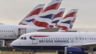 <p>British Airways passenger jets at Heathrow Airport.</p>