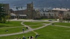 Students on Libe Slope at the Cornell University campus in Ithaca, US, on Tuesday, April 11, 2023. US college costs just keep climbing and the increase is pushing the annual price for the upcoming academic year at Ivy League schools toward yet another hold-on-to-your-mortarboard mark. Photographer: Bing Guan/Bloomberg